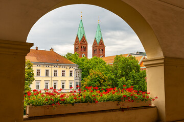 Aerial view of the city through an architectural arch in Maribor, Slovenia.