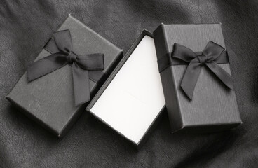 Open Gift box on black leather background