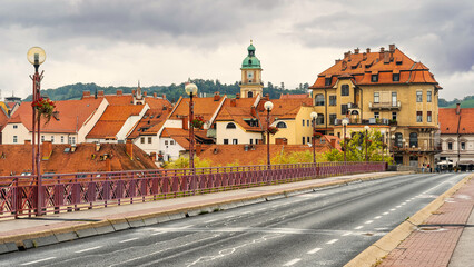 An old iron bridge linking both banks of the Drava River in the city of Maribor, Slovenia.