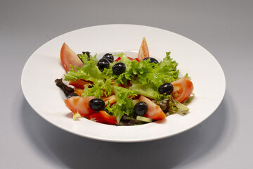 Vegetable salad served as a meal, showing fresh ingredients mixed together and reflecting healthy nutrition and everyday dining culture.