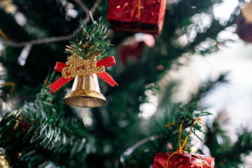 Beautifully decorated Christmas tree with lights and ornaments, creating a warm festive atmosphere for Christmas and New Year celebration.