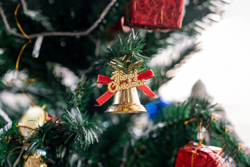 Beautifully decorated Christmas tree with lights and ornaments, creating a warm festive atmosphere for Christmas and New Year celebration.