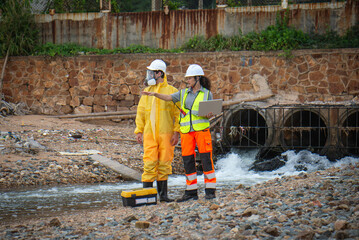 Scientists and assistants are collecting water samples from natural sources to analyze contaminants from water discharged from industrial plants.