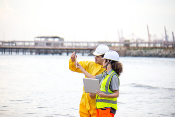 Scientists and assistants are collecting water samples from natural sources to analyze contaminants from water discharged from industrial plants.