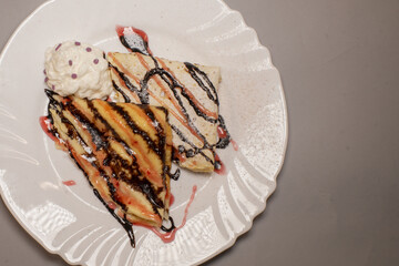Asian cuisine dish served on a plate with gray background, reflecting traditional food culture