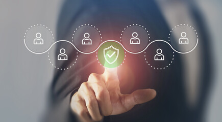 Workplace Safety Concept. Interacting with a digital interface displaying user icons and a security shield, symbolizing workplace safety, data protection and secure employee management systems.