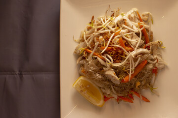 Asian cuisine dish served on a plate with gray background, reflecting traditional food culture