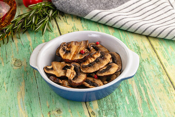Tasty hot grilled champignon mushrooms