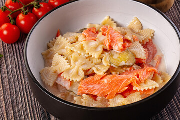 Italian pasta farfalle with salmon