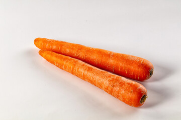 Young orange ripe carrot heap