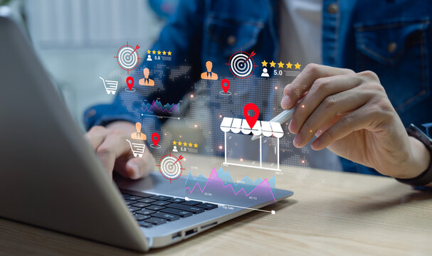 Business analyst uses laptop for local business marketing and SEO strategy, analyzing reviews, location insights, performance charts, and customer feedback for growth.