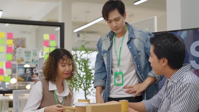 Creative business  product developers actively brainstorm ideas, sharing discussions ESG  green energy focusing on product repackaging and reuse strategies to reduce costs maximize profit business
