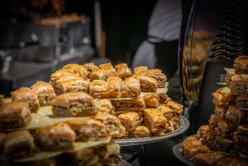 A market stall display of a tray stacked high with baklava.