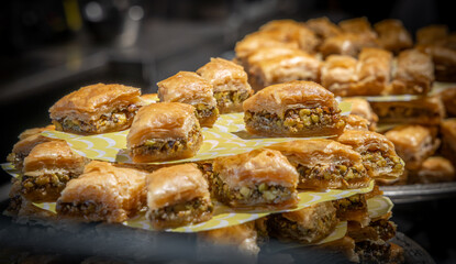 A market stall display of a tray stacked high with baklava.