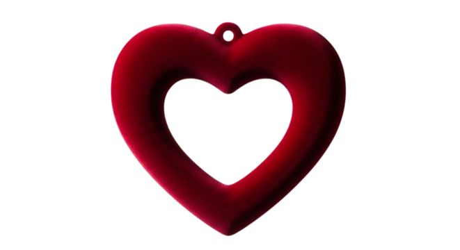 Deep red velvet heart shape with a hole for hanging isolated on a transparent background love