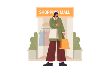 Woman with shopping bags outside a store