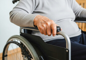 Obraz premium Close-up of Hand on Wheelchair Armrest