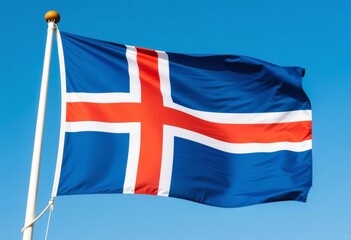 National flag of Iceland waving against a clear blue sky, mounted on a silver flagpole, showcasing national identity, symbolism, and patriotic presence. Iceland Flag.
