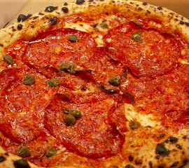 Italian pizza in close up, showing detailed toppings and texture, reflecting Mediterranean cuisine