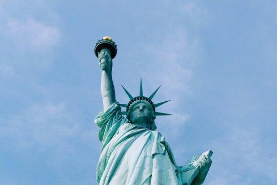 statue of liberty new york city, view looking up at the brown and torch