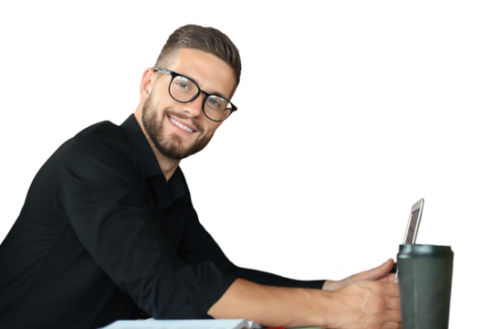 Young business man is using laptop looking at camera, smiling on a transparent background