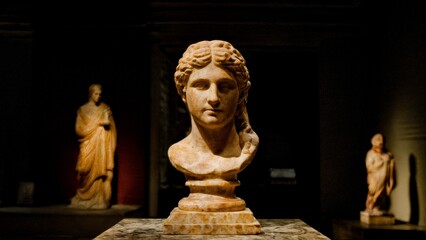 A group of statues in a museum