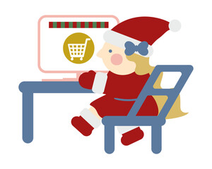 パソコンでネットショッピングをするかわいい女の子のサンタクロース