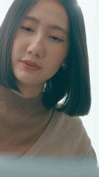 Vertical Screen : Closeup group Adult Asia male, female freelance meeting write prompt AI bot app program nomad, video game, talk strategy, discuss plan, user interface, data center desktop computer.