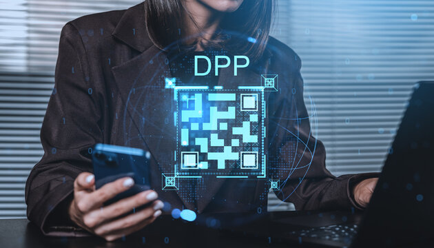 Woman using smartphone and laptop with digital product passport