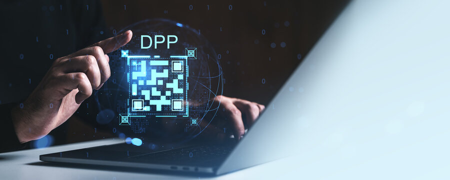 Digital product passport concept with QR code interface hovering above laptop as hand interacts with futuristic hologram display in technology setting.