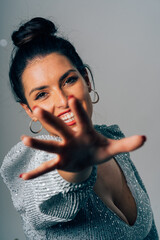 Woman smiling reaching hand festive christmas party