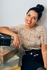 Woman smiling receiving gift packages for christmas party