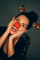 Woman wearing reindeer costume celebrating christmas holidays