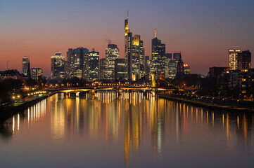 Skyline of Frankfurt, Germany, with reflections in the river Main. Long exposure.