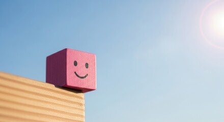 Embrace the Power of Optimism: A Pink Cube with a Smiling Face Set Against a Bright Blue Sky as Background for Your Ideas