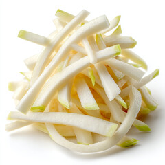 A pile of julienned daikon radish with light green tips on a white surface in a studio shot