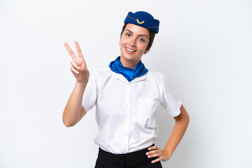 Airplane stewardess caucasian woman isolated on white background smiling and showing victory sign