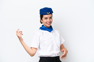 Airplane stewardess caucasian woman isolated on white background making guitar gesture
