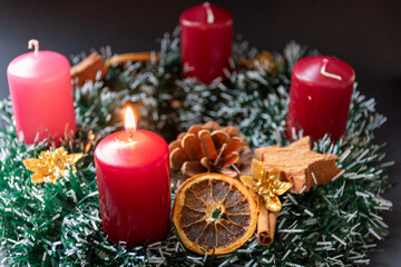 Advent whreat with one burning candle
