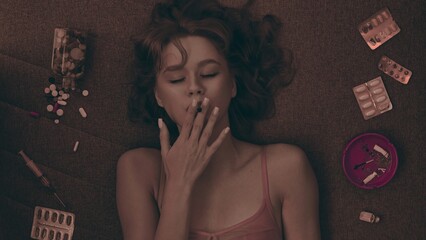 Vicious woman with drugs, cigarettes and pills