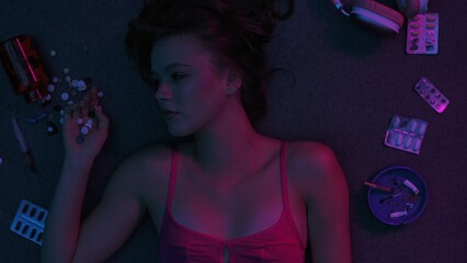 Vicious woman with drugs, cigarettes and pills