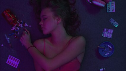 Vicious woman with drugs, cigarettes and pills