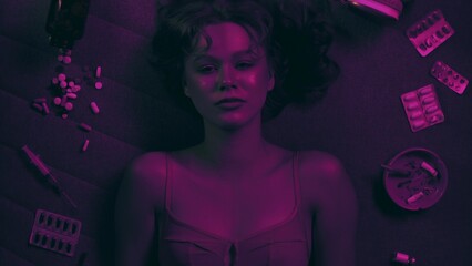 Vicious woman with drugs, cigarettes and pills
