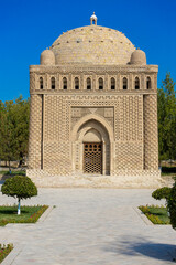 Exterior view of the Samanid Mausoleum in Bukhara, Uzbekistan. Building is cuboid shape with baked brick decoration is combines multi-cultural ancient eastern motifs. Built in the 10th century CE