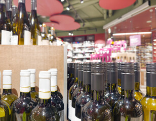 defocused alcohol (wine, champagne, liquor, whiskey) on store shelves