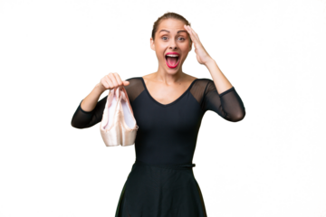 Young caucasian woman practicing ballet over isolated background with surprise expression