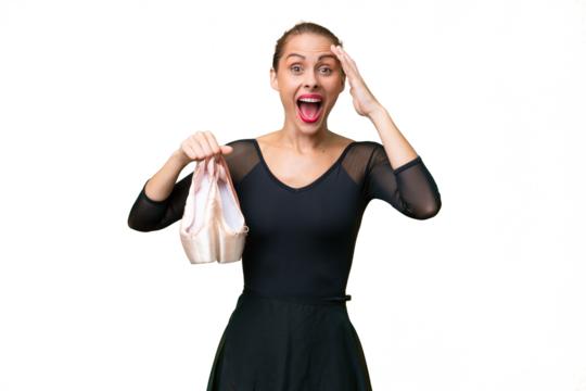 Young caucasian woman practicing ballet over isolated background with surprise expression