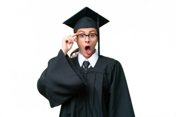 Young university graduate caucasian woman over isolated background with glasses and surprised