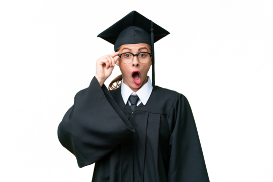 Young university graduate  caucasian woman over isolated background with glasses and surprised