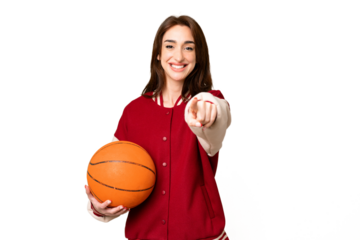 Young basketball player woman over isolated chroma key background pointing front with happy expression